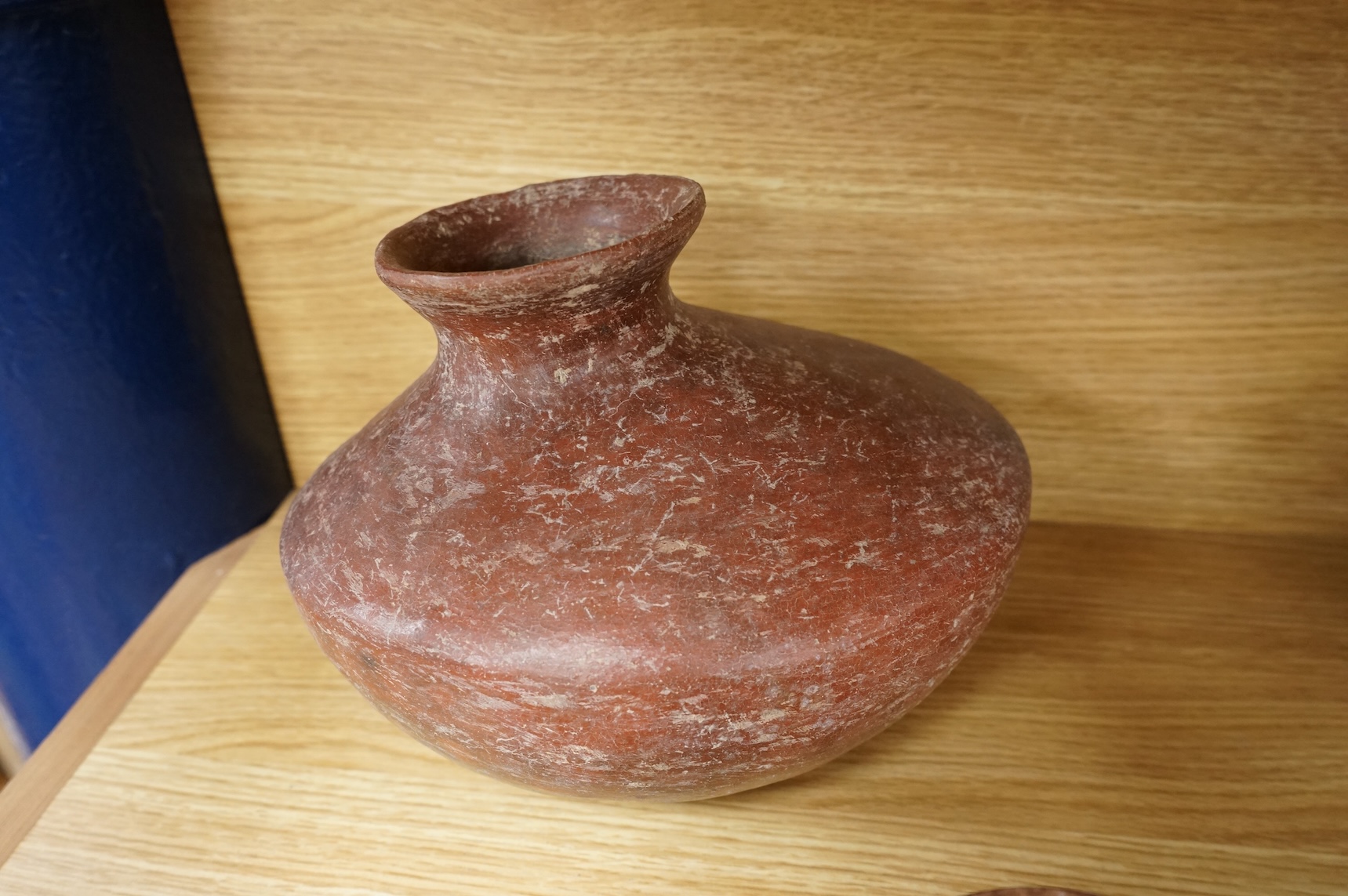 A collection of various South American vessels some in the form of grotesque heads, largest 24cm wide